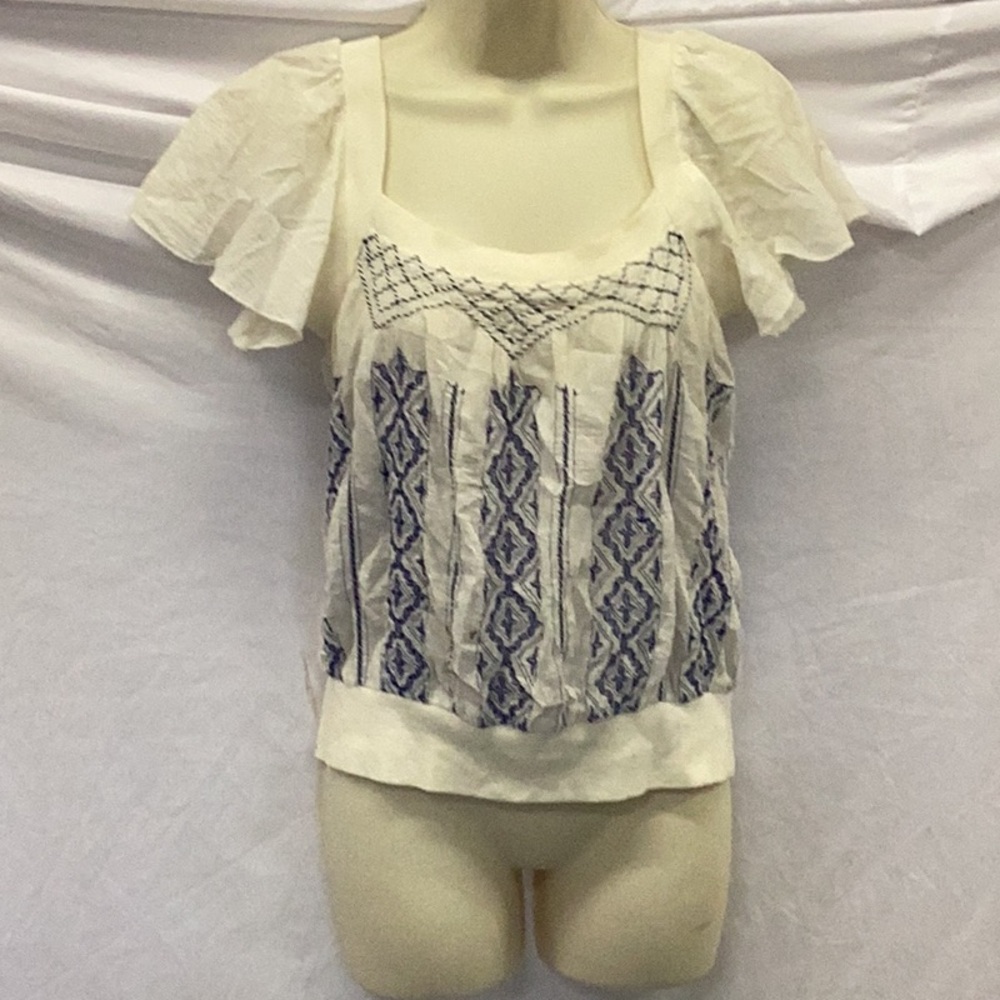 Free people Cream and blue top.